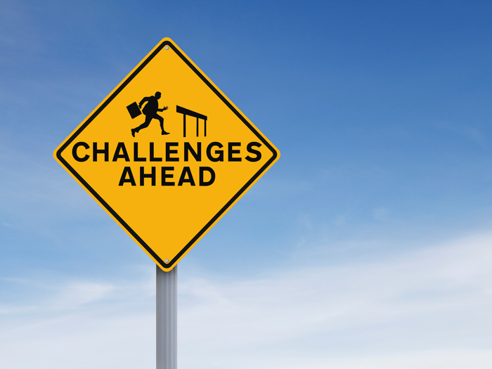 road sign that says Challenges Ahead, representing the challenges of seeking treatment for depression that many face