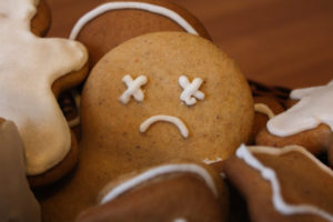 Sad gingerbread man showing how stress and anxiety can lead to holiday depression.