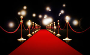 A red carpet against black background, signifying how famous people with depression can lessen depression stigma.