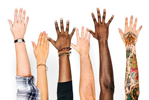 Picture of six arms held up with all different skin tones, demonstrating that depression and anxiety doesn’t look the same in everyone.