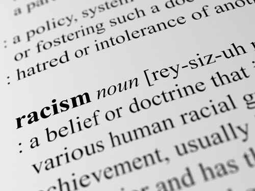 Dictionary definition of racism, relevant to how racism impacts mental health