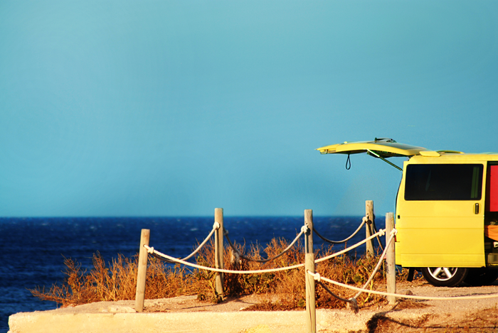 a yellow van on the beach, representing AWARE founder Jarlath McCreanor's yellow car