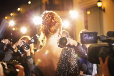 Celebrity photographed at red carpet event, showing how even famous people can struggle with anxiety.