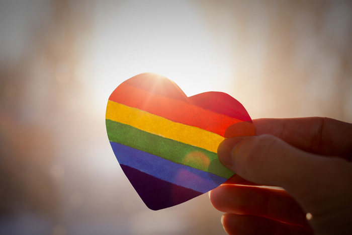 a paper rainbow heart representing LGBTQ mental health 