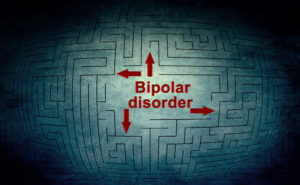Image of a maze with the word “bipolar disorder” (another term for manic depression) and arrows pointing in four different directions.