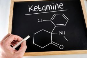 ketamine formula written on a chalkboard, visually representing a new depression treatment