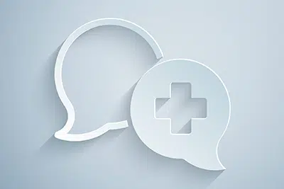 Paper cut dialogue icons with the doctor icon in one bubble, showing importance of communicating with patients