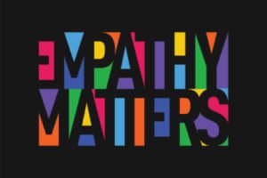 “Empathy Matters” written in colorful letters on a black background showing the importance of communicating with a patient.
