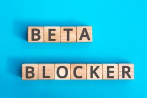 Beta blocker inscription wooden cubes with letters on a blue background.