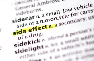 lose-up photo of the words side effect and its impact on mental health medication adherence. 