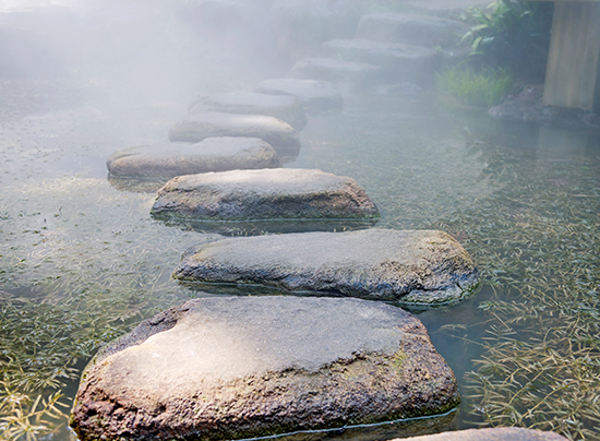 image of stepping stones in a stream indicating the importance of taking one step forward for mental health