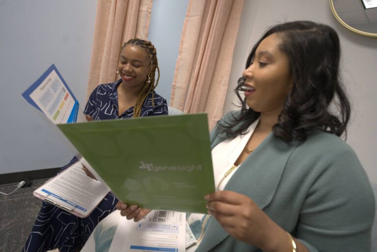 Dr. Whitnee Brown, DNP, CRNP, PMHNP, FNP, reviewing the GeneSight test results with her patient.