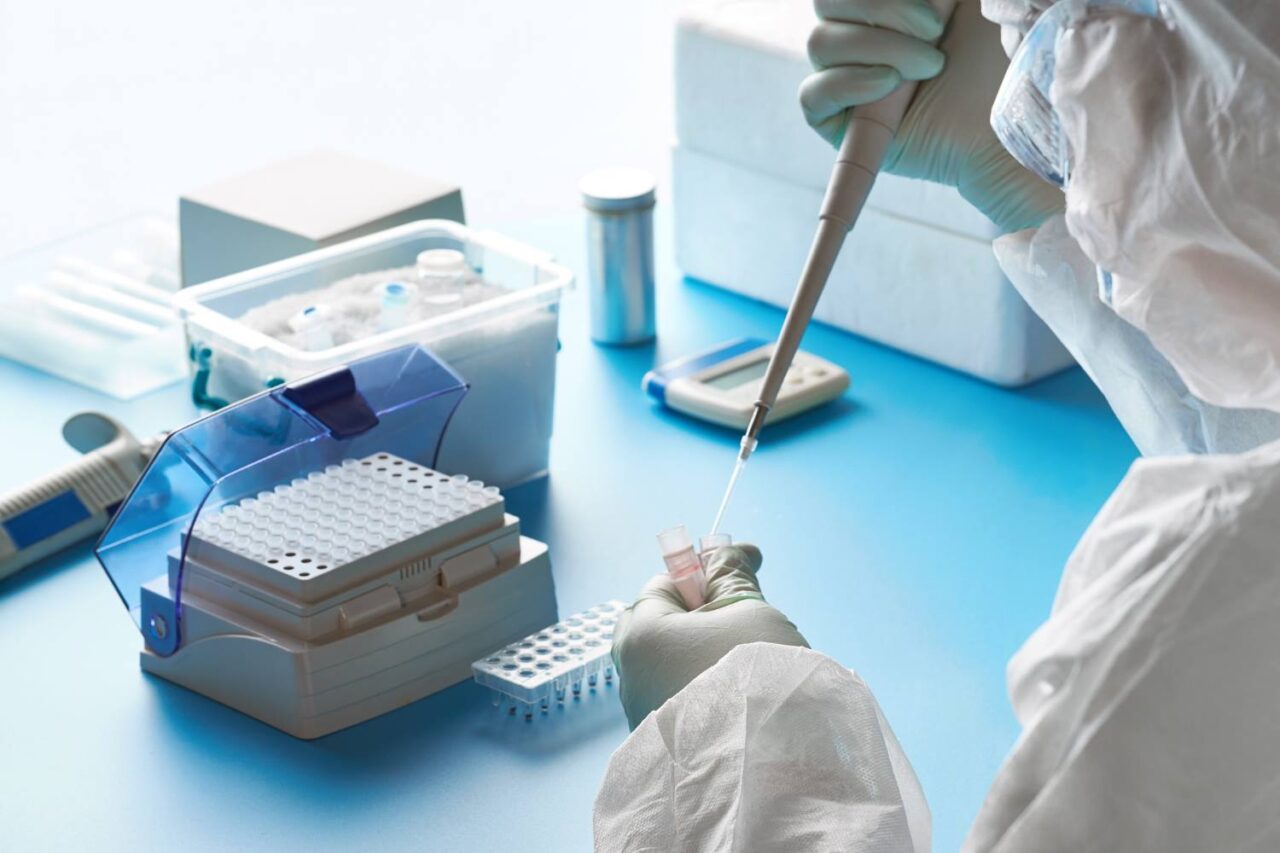 Image of a lab worker checking patient samples.